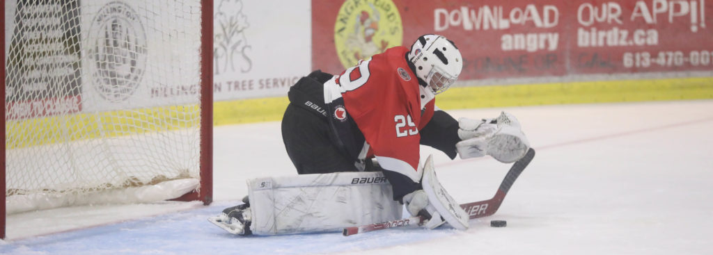 Nolan Lane smothers a loose puck during a game earlier this season. Lane backstopped the Pirates to a 4-0 win Thursday night, (Photo: Shawna Adams)