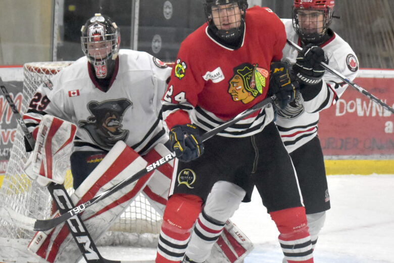 Lakefield’s Gregg Sheedy makes life misrable for Picton netminder Nolan Lane and defenceman Will Potts. (Jason Parks/Gazette Staff)